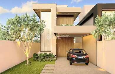 Imagem: A casa possui 3 Dormitórios, 2 Banheiros, 2 Vagas na garagem