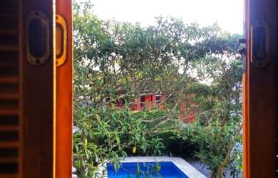 Imagem: A casa possui 2 Dormitórios, 2 Vagas na garagem e está localizado