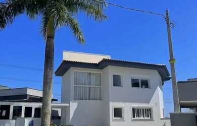 Imagem: A casa possui 3 Dormitórios, 5 Banheiros, 4 Vagas na garagem