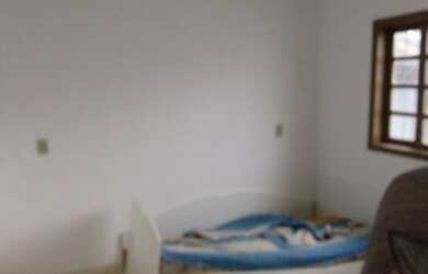 Imagem: A casa possui 3 Dormitórios, 1 Banheiro e está localizado