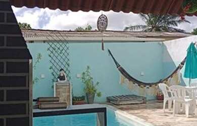 Imagem: A casa à venda possui 1 Dormitório, 2 Banheiros, 1 Vaga na