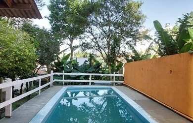 Imagem: A casa possui 3 Dormitórios, 3 Banheiros, 3 Vagas na garagem