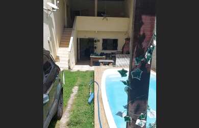 Imagem: A casa possui 4 Dormitórios, 2 Vagas na garagem e está localizado