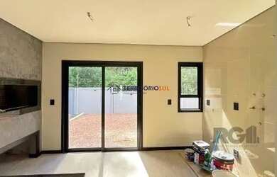 Imagem 14: Casa em Porto Alegre, no bairro Hípica, com 3 dormitório s , e 3 banheiros,...