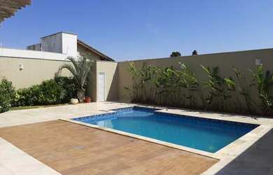 Imagem: A casa possui 3 Dormitórios, 5 Banheiros, 5 Vagas na garagem