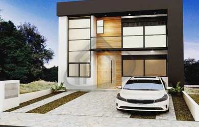 Imagem: A casa possui 3 Dormitórios, 3 Banheiros, 2 Vagas na garagem