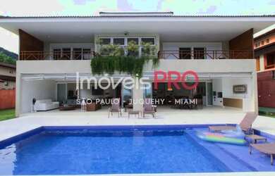 Imagem: A casa possui 5 Dormitórios, 5 Banheiros, 4 Vagas na garagem