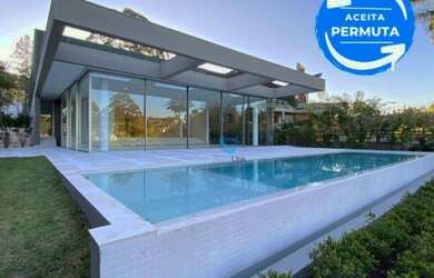 Imagem: A casa em condomínio possui 5 Dormitórios, 5 Banheiros, 5