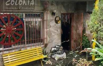 Imagem: A casa possui 3 Dormitórios, 3 Banheiros, 2 Vagas na garagem