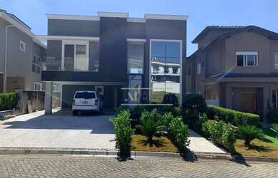 Imagem: A casa em condomínio à venda possui 4 Dormitórios, 5 Banheiros