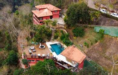 Imagem: A casa em condomínio à venda possui 5 Dormitórios, 5 Banheiros