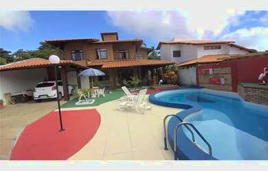 Imagem: A casa possui 4 Dormitórios, 4 Banheiros, 4 Vagas na garagem