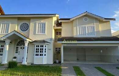 Imagem: A casa em condomínio possui 4 Dormitórios, 5 Banheiros, 5