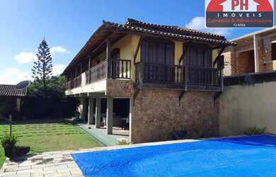 Imagem: A casa possui 3 Dormitórios, 4 Banheiros, 5 Vagas na garagem