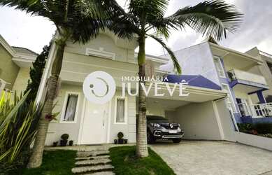 Imagem: A casa possui 4 Dormitórios, 5 Banheiros, 2 Vagas na garagem