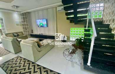 Imagem: A casa possui 5 Dormitórios, 4 Banheiros, 4 Vagas na garagem