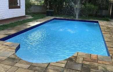 Imagem: A casa possui 5 Dormitórios, 4 Banheiros, 5 Vagas na garagem