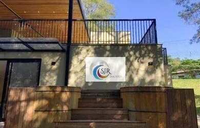 Imagem: A casa possui 5 Dormitórios, 5 Banheiros, 5 Vagas na garagem