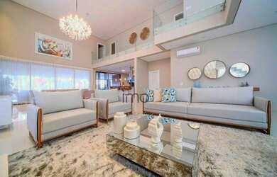 Imagem: A casa em condomínio possui 4 Dormitórios, 5 Banheiros, 700m²