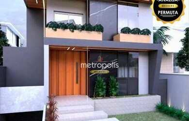 Imagem: A casa em condomínio possui 4 Dormitórios, 4 Banheiros, 660m²