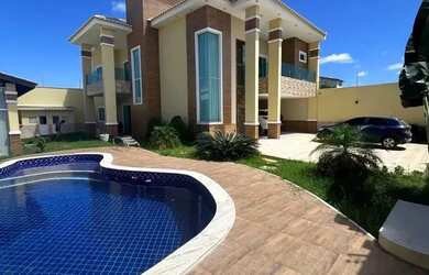 Imagem: A casa possui 5 Dormitórios, 5 Banheiros, 5 Vagas na garagem