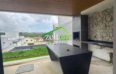 Imagem: A casa possui 3 Dormitórios, 4 Banheiros, 2 Vagas na garagem