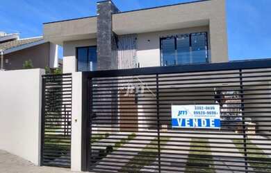 Imagem: A casa possui 3 Dormitórios, 4 Banheiros, 2 Vagas na garagem