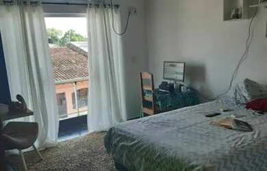 Imagem: A casa possui 2 Dormitórios, 2 Banheiros e está localizado