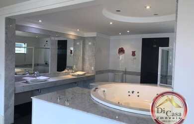 Imagem: A casa possui 4 Dormitórios, 4 Banheiros, 3 Vagas na garagem