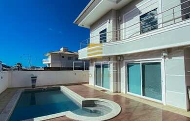 Imagem: A casa possui 4 Dormitórios, 4 Banheiros, 3 Vagas na garagem