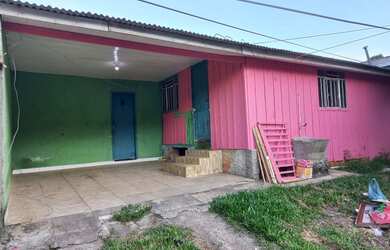 Imagem: A casa possui 3 Dormitórios, 1 Banheiro, 5 Vagas na garagem