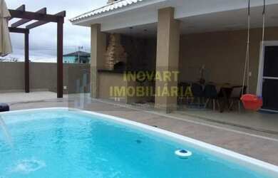 Imagem: A casa possui 3 Dormitórios, 1 Banheiro, 1 Vaga na garagem