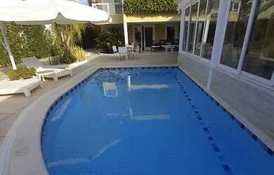 Imagem: A casa em condomínio possui 4 Dormitórios, 5 Banheiros, 4