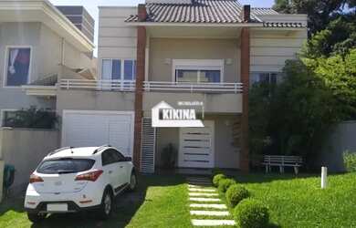 Imagem: A casa em condomínio possui 5 Dormitórios, 3 Banheiros, 2