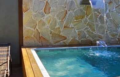 Imagem: A casa possui 4 Dormitórios, 4 Banheiros, 2 Vagas na garagem