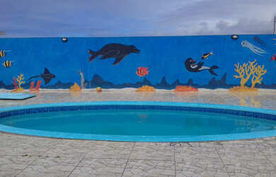 Imagem: A casa possui 3 Dormitórios, 3 Banheiros, 4 Vagas na garagem