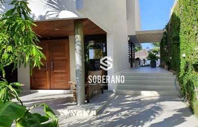 Imagem: A casa possui 4 Dormitórios, 5 Banheiros, 5 Vagas na garagem