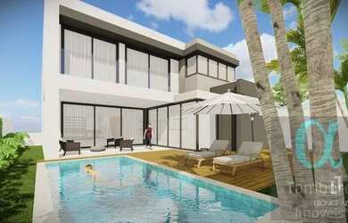 Imagem: A casa possui 4 Dormitórios, 5 Banheiros, 5 Vagas na garagem