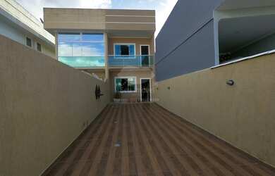 Imagem: A casa possui 2 Dormitórios, 1 Banheiro, 3 Vagas na garagem