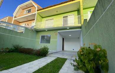 Imagem: A casa possui 3 Dormitórios, 1 Banheiro, 2 Vagas na garagem