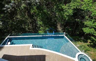 Imagem: A casa em condomínio possui 4 Dormitórios, 5 Banheiros, 4