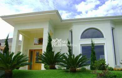 Imagem: A casa em condomínio possui 4 Dormitórios, 5 Banheiros, 4