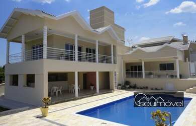 Imagem: A casa em condomínio possui 5 Dormitórios, 5 Banheiros, 2