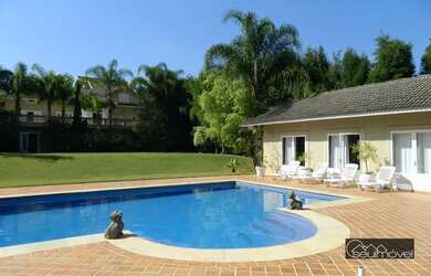 Imagem: A casa em condomínio possui 5 Dormitórios, 5 Banheiros, 4