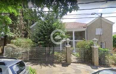 Imagem: A casa possui 4 Dormitórios, 5 Banheiros, 5 Vagas na garagem