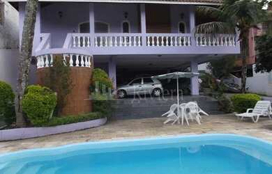 Imagem: A casa possui 5 Dormitórios, 3 Banheiros, 5 Vagas na garagem