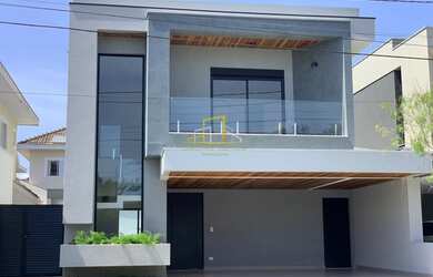 Imagem: A casa possui 4 Dormitórios, 4 Banheiros, 4 Vagas na garagem