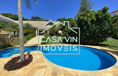 Imagem: A casa possui 3 Dormitórios, 5 Banheiros, 5 Vagas na garagem