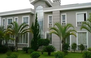 Imagem: A casa em condomínio possui 5 Dormitórios, 5 Banheiros, 5