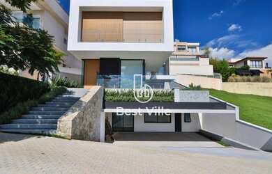 Imagem: A casa em condomínio possui 4 Dormitórios, 5 Banheiros, 4